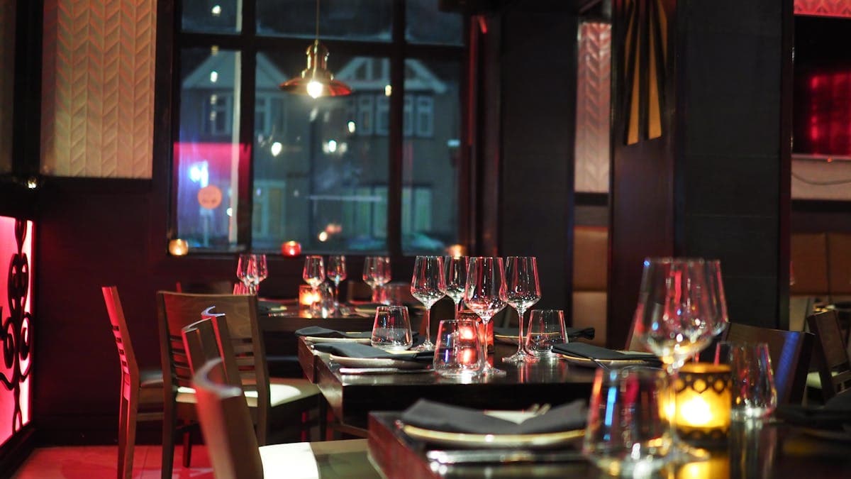 Elegant restaurant table setting with warm lighting and polished interior