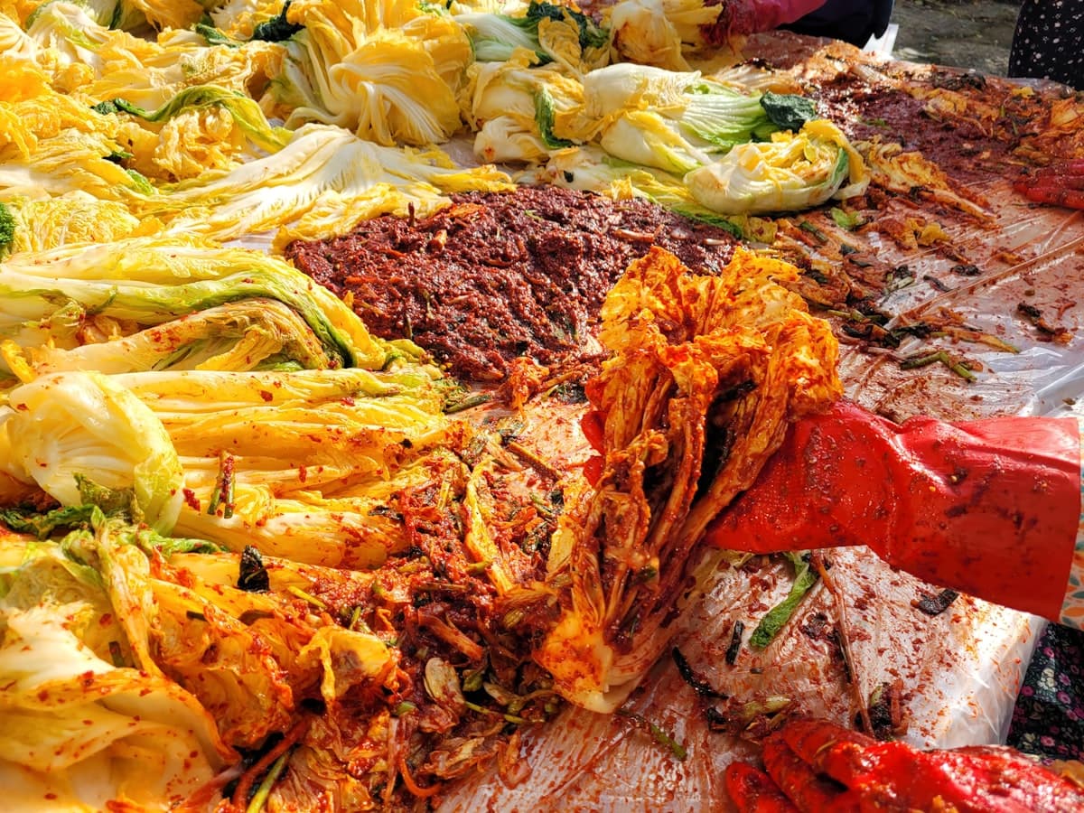 Korean barbecue table loaded with share plates, meats, and side dishes
