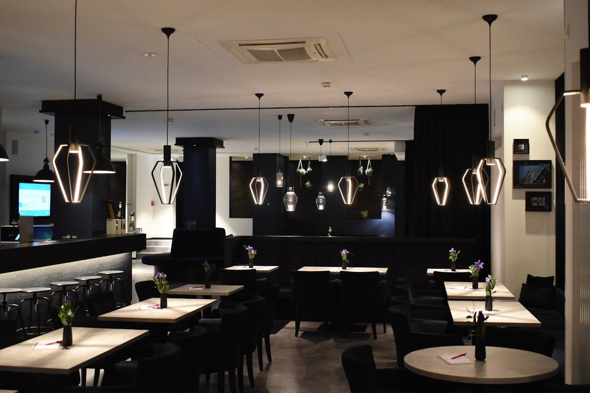 Moody restaurant interior with artistic lighting and intimate dining atmosphere