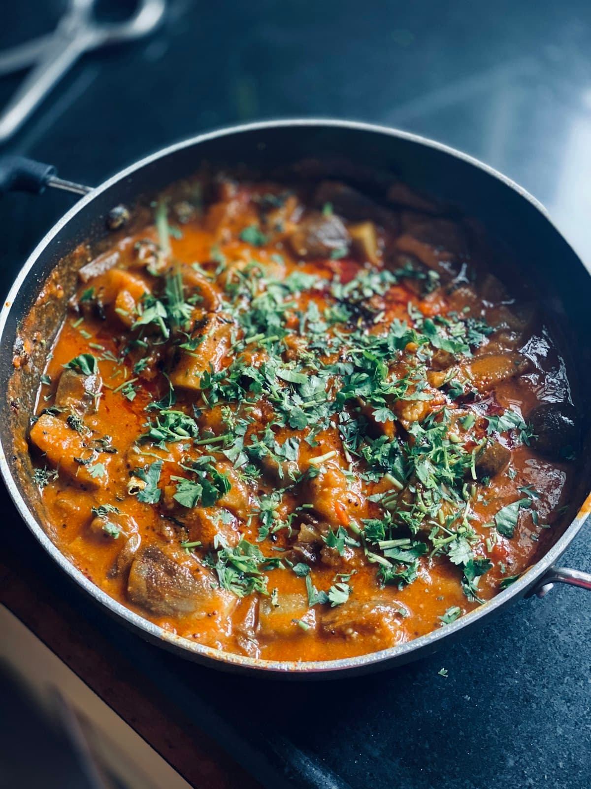 Colorful vegetarian dishes with vibrant spices on a warm-toned table setting