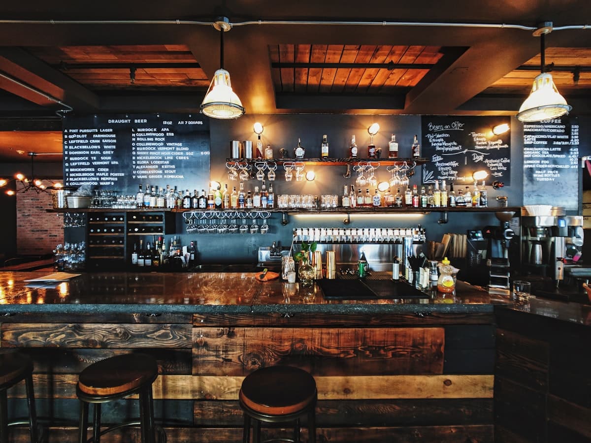 Warmly lit New York City restaurant interior with diners enjoying a meal