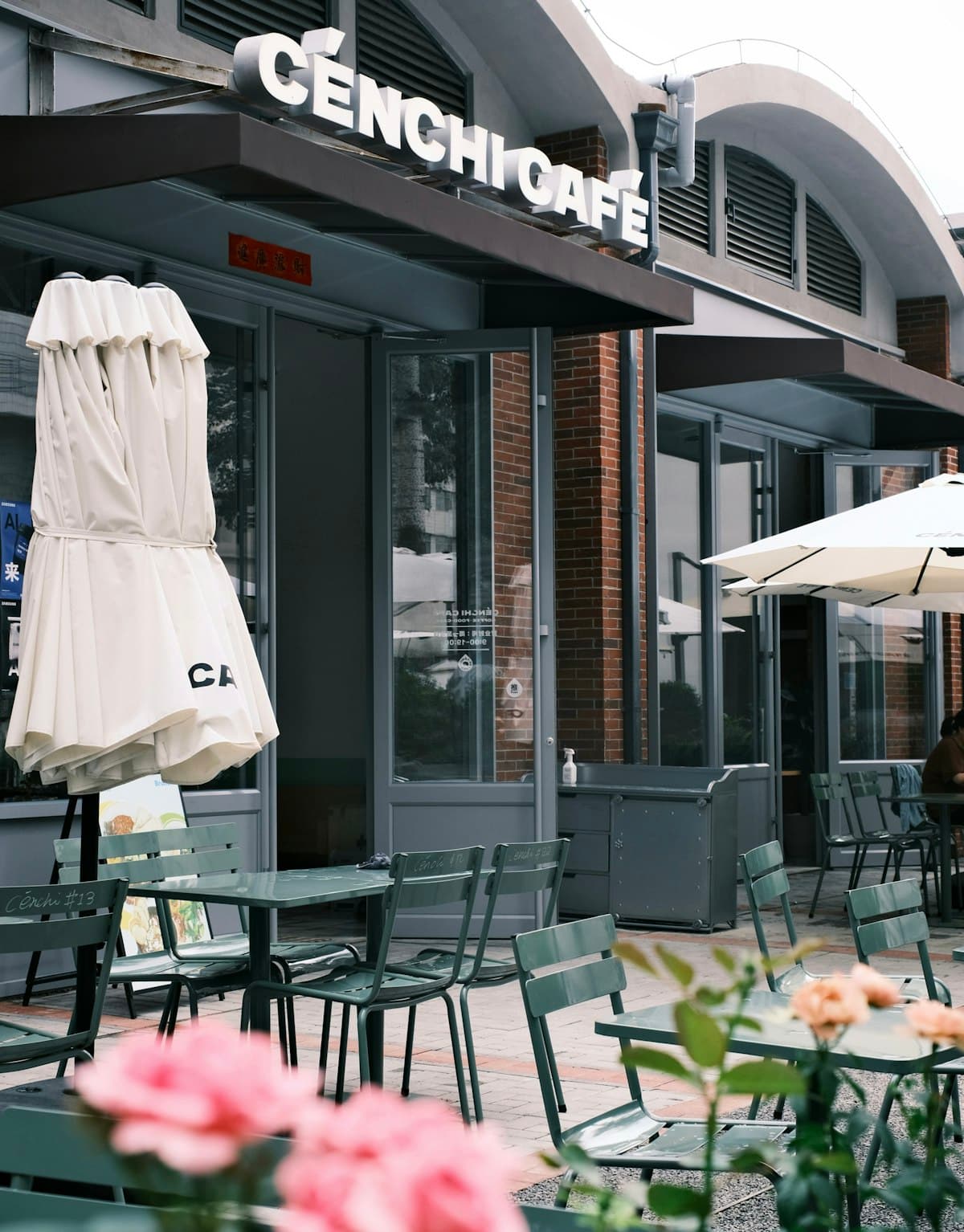 Outdoor restaurant patio with tables and umbrellas at dusk, evoking Boston spring dining season