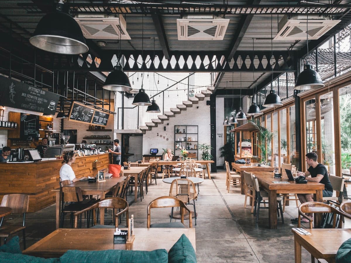 A cozy, dimly lit restaurant interior with warm lighting and intimate seating in Los Angeles