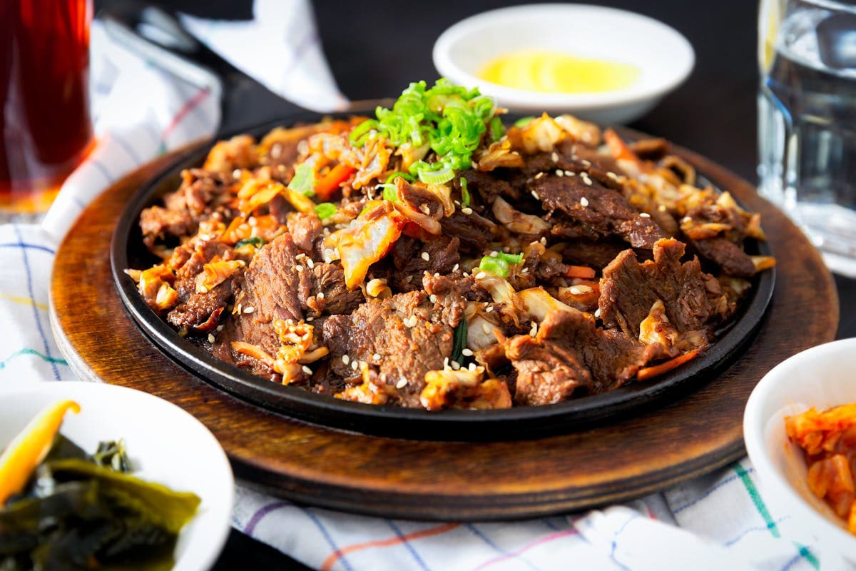 Grilled meat with dramatic presentation at an upscale Korean steakhouse