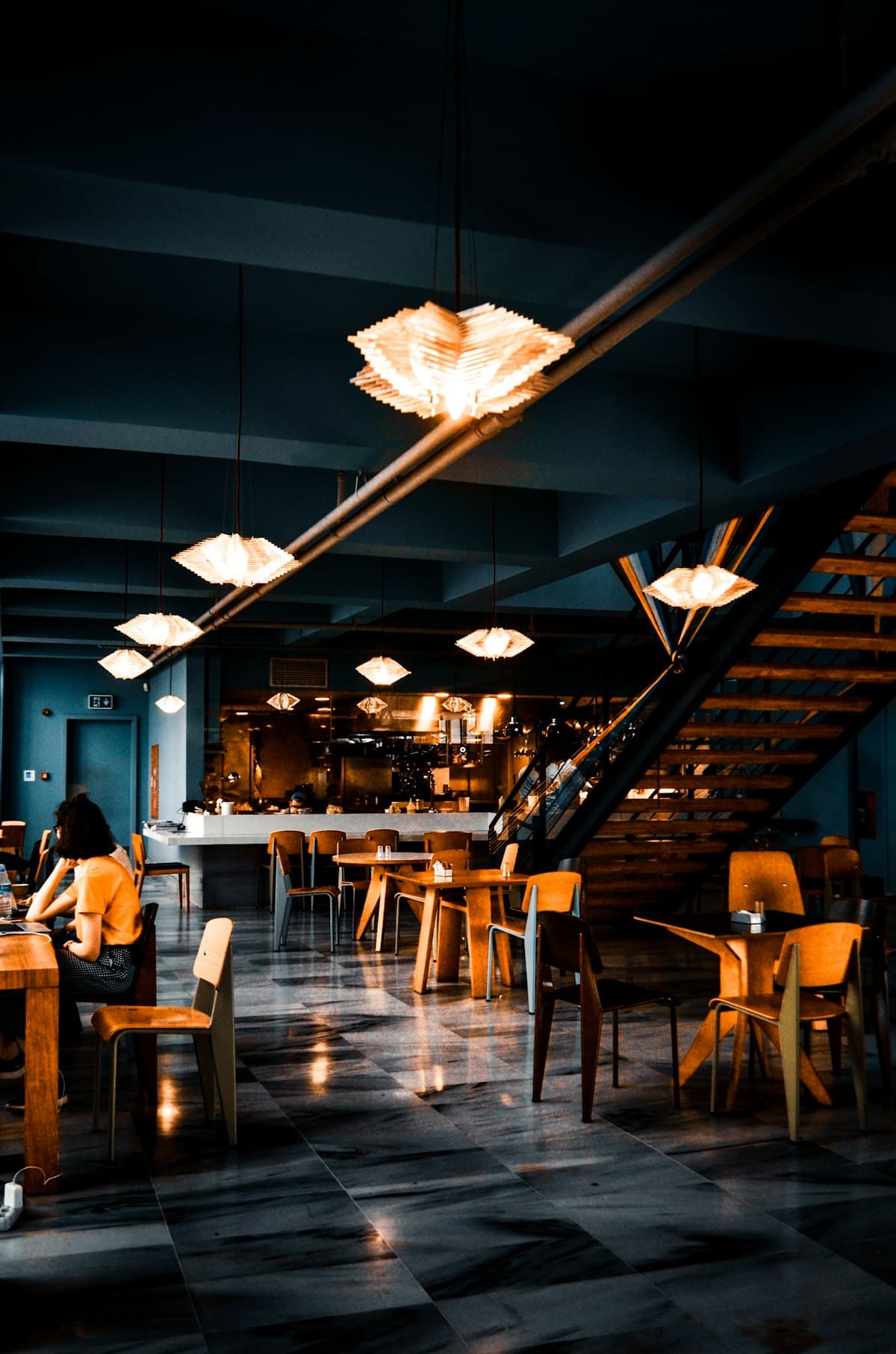 Elegant restaurant interior with warm lighting and table settings in Los Angeles