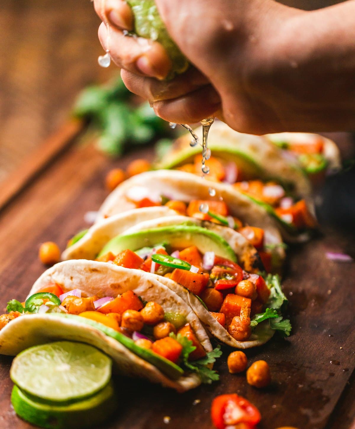 Colorful Mexican tacos and dishes on a vibrant table spread in Mexico City
