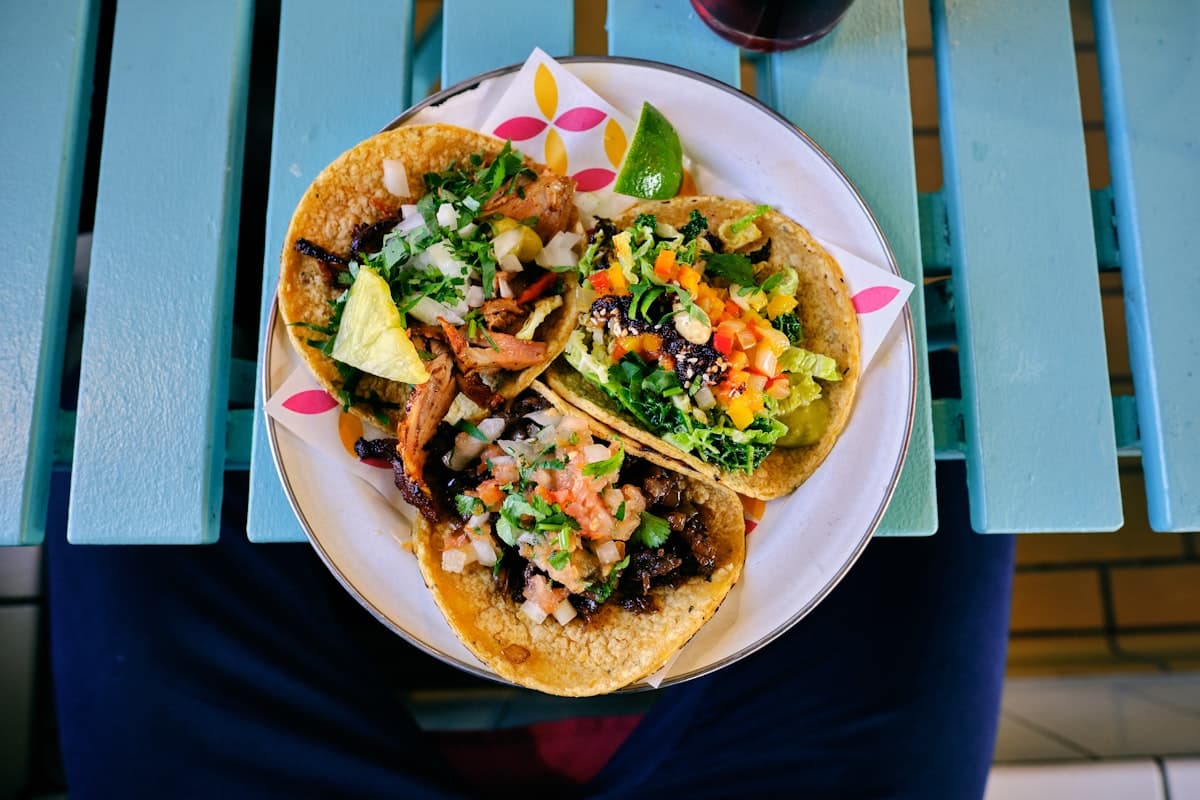 Elegant plated Mexican fine dining dishes in a contemporary restaurant setting