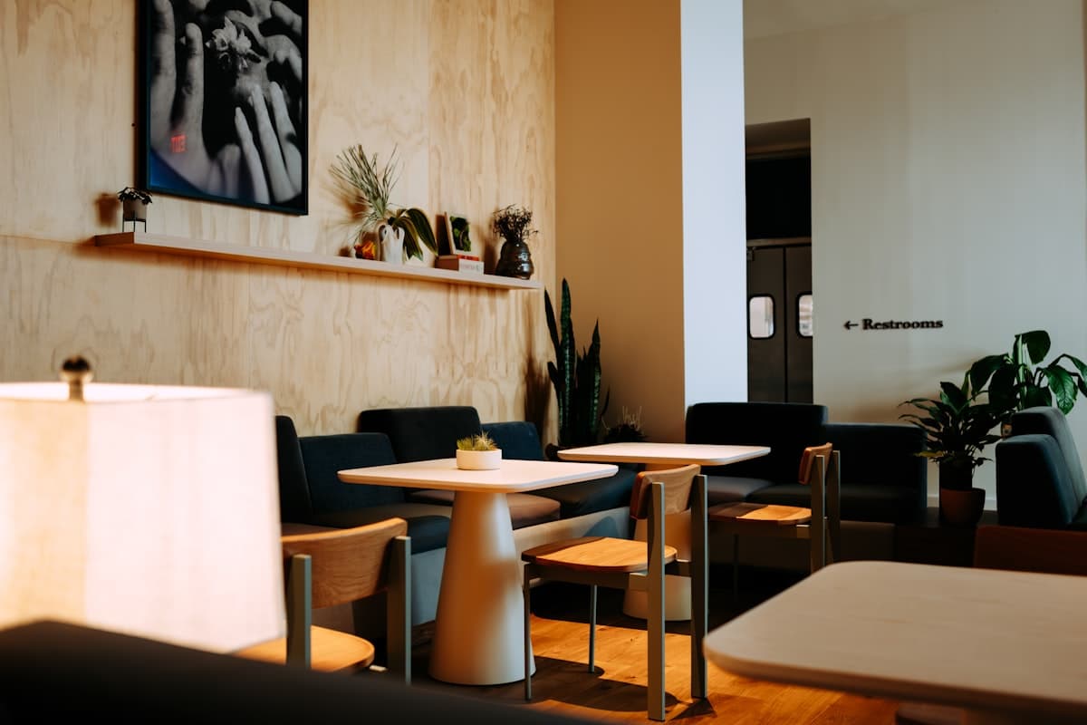 A warmly lit San Francisco restaurant table set for dinner with glassware and small plates